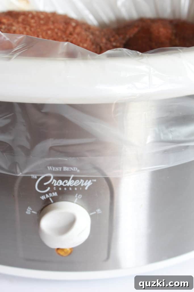 Crock Pot Pulled Pork Recipe featured by top US food blog, Practically Homemade
