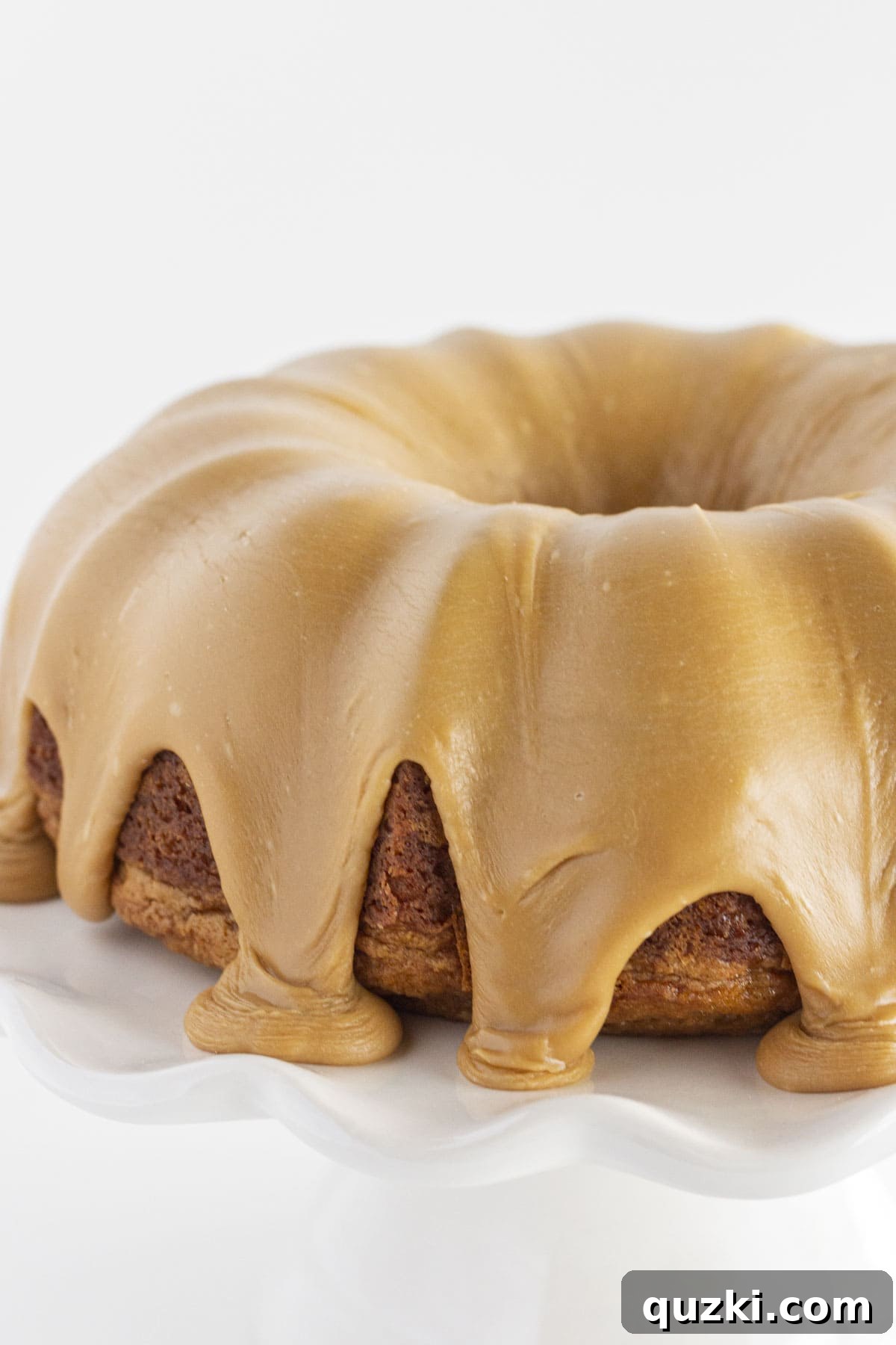 A Biscoff cookie Bundt cake with a smooth glaze, showing perfect adherence.