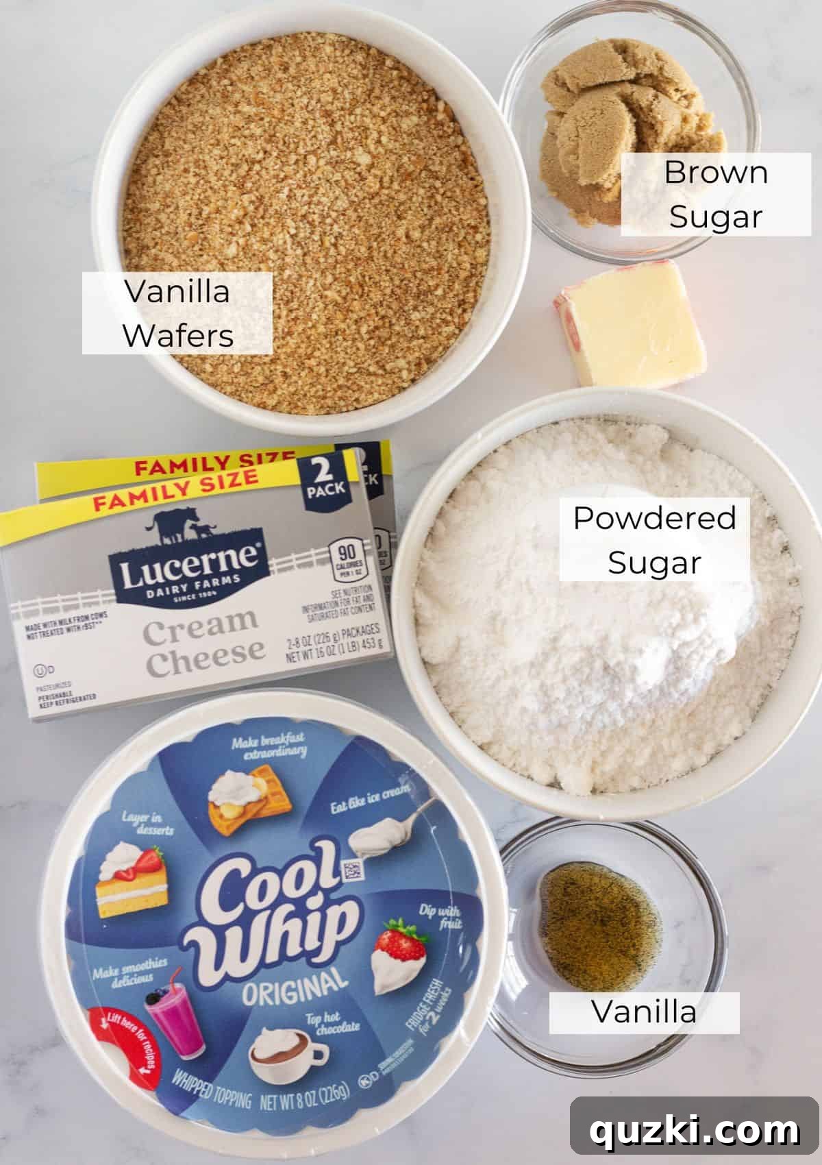 Effortless No-Bake Cheesecake Bars 3 All the necessary ingredients laid out neatly to prepare delicious no-bake cheesecake bars at home.