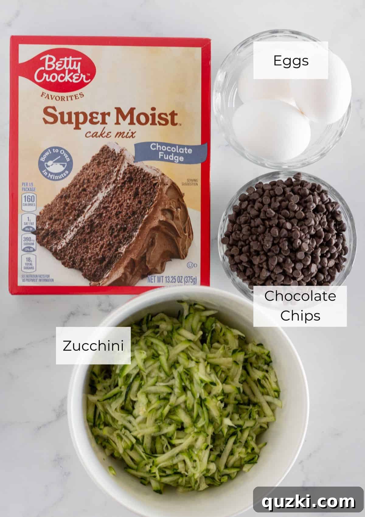 No-Fail Double Chocolate Zucchini Bread Cake Mix 3 The simple ingredients needed to make chocolate zucchini loaf, including a cake mix, zucchini, eggs, and chocolate chips.