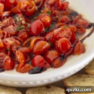 Fresh homemade bruschetta dip on creamy ricotta.