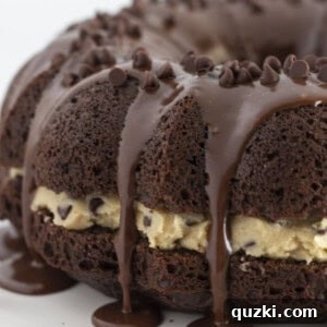 A cookie dough cake with a chocolate bundt cake, beautifully garnished.