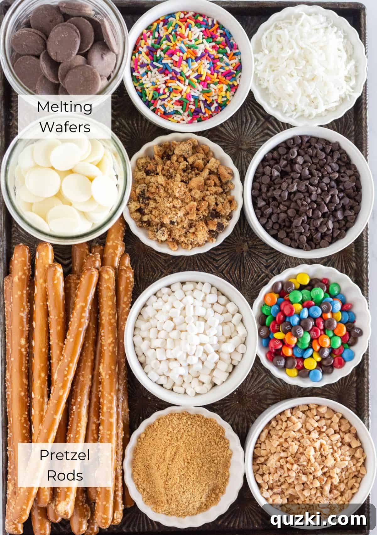 Sweet & Salty Chocolate Pretzel Rods 3 The ingredients needed to make chocolate dipped pretzel with various topping ideas laid out.