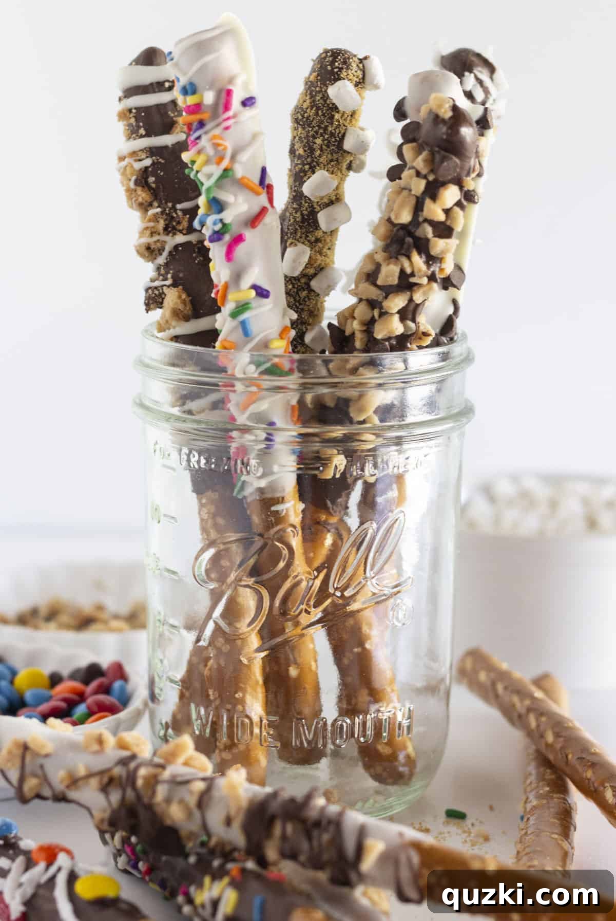 Sweet & Salty Chocolate Pretzel Rods 6 Delicious chocolate covered pretzel rods ready to be served, piled high on a serving tray.