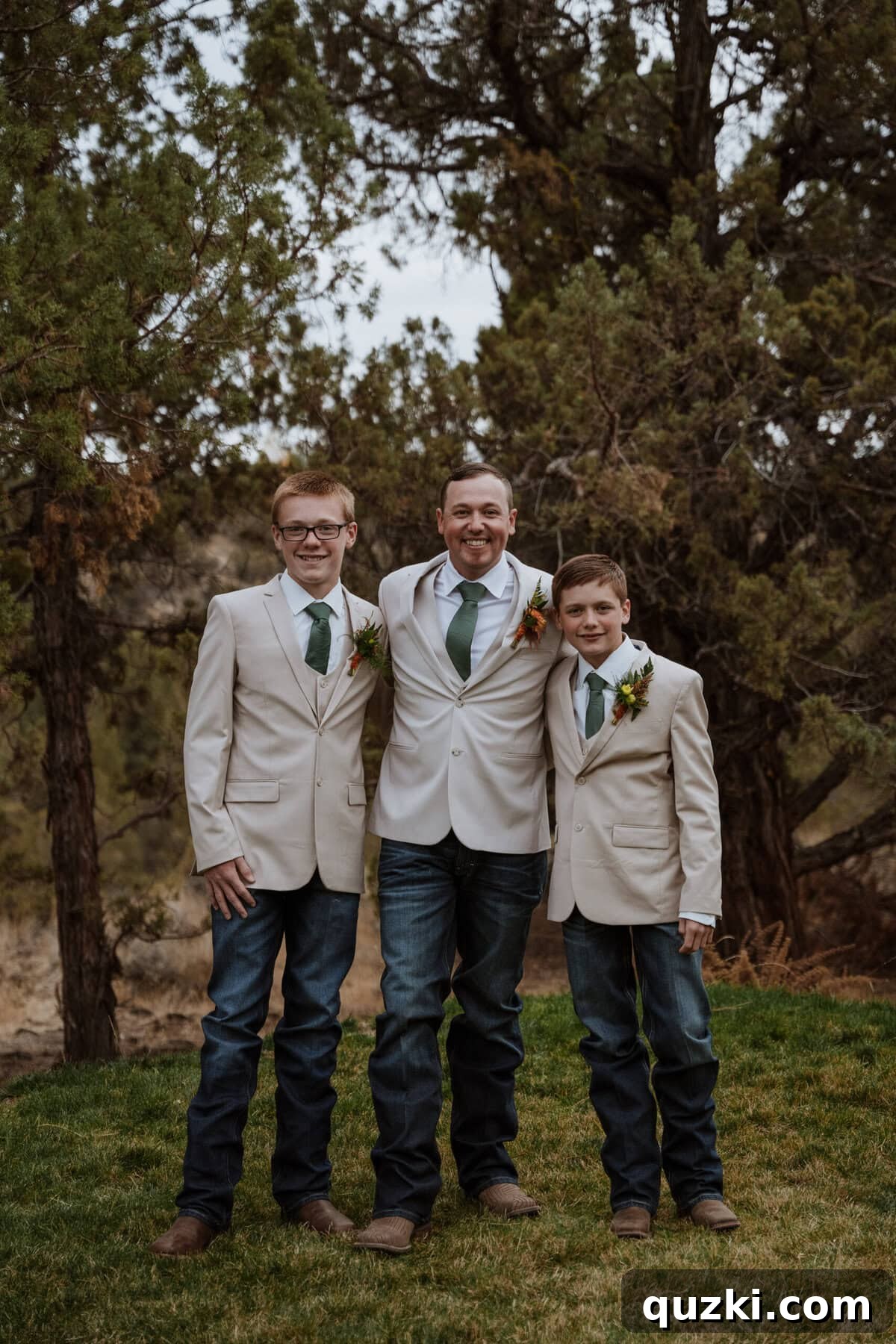 Jordan, the groom, proudly standing with his two sons, Wyatt and Weston, who served as groomsmen, looking sharp and happy.