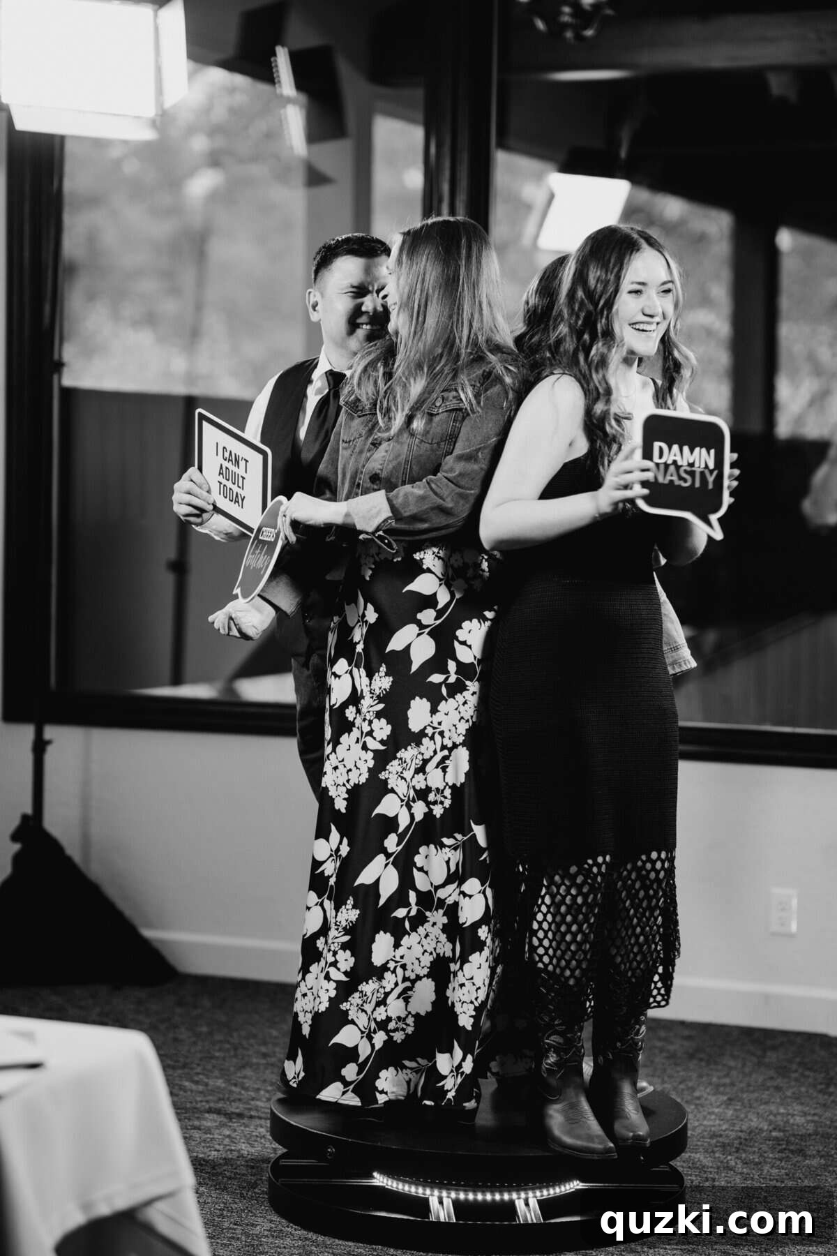 Guests having a blast on the 360 photo booth, creating fun and dynamic videos during the wedding reception, adding an interactive entertainment element.