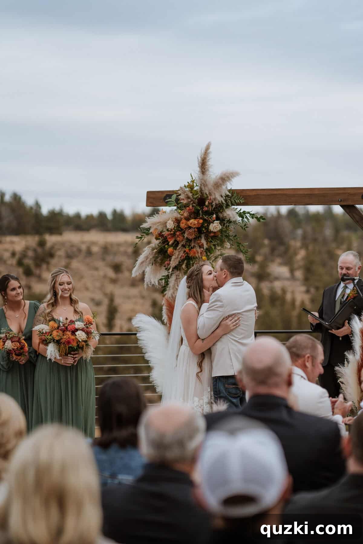 The newly married couple, Taylea and Jordan, sharing their deeply romantic and joyful first kiss as husband and wife, marking the start of their new journey.