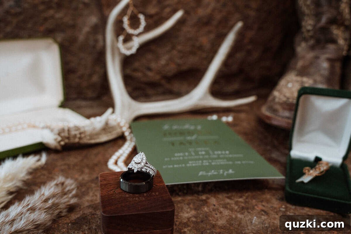 A detailed flat lay photograph showcasing important wedding accessories: the rings, a vintage broach on the bouquet, Grandma Anna Mae's pearl necklace, the wedding invitation, and the bride's earrings.