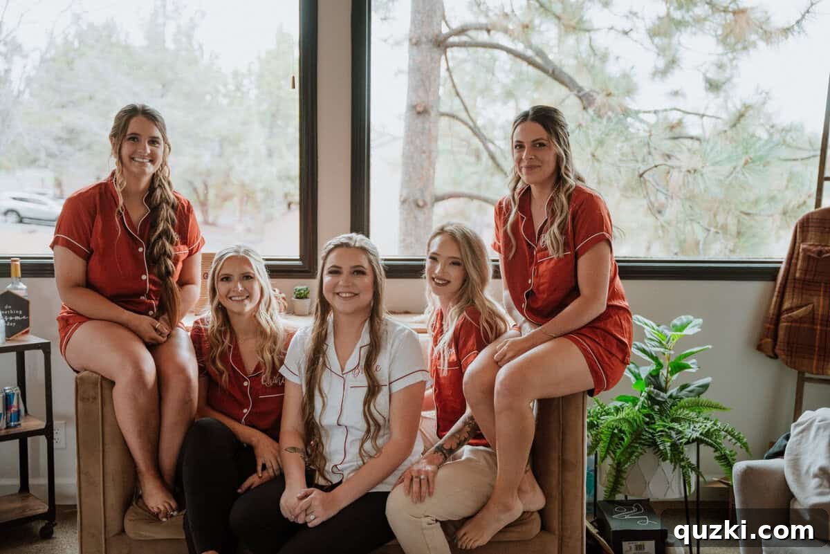 The bridal party laughing and getting ready together in personalized pajamas at the wedding venue, surrounded by joyful energy.