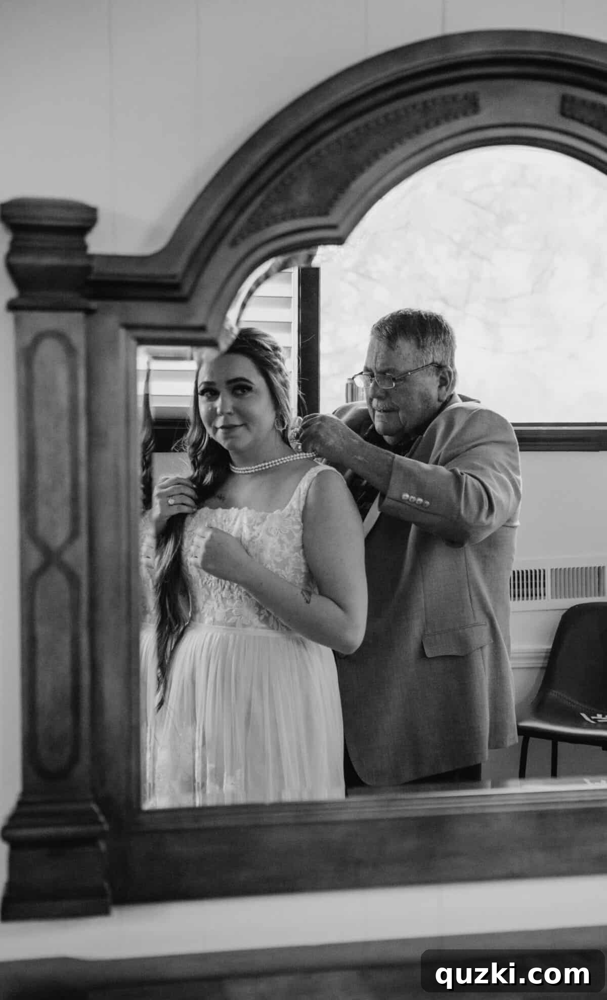Taylea's grandfather, Papa, lovingly placing a beautiful pearl necklace, a family heirloom, around her neck before the wedding ceremony, a moment filled with emotion.