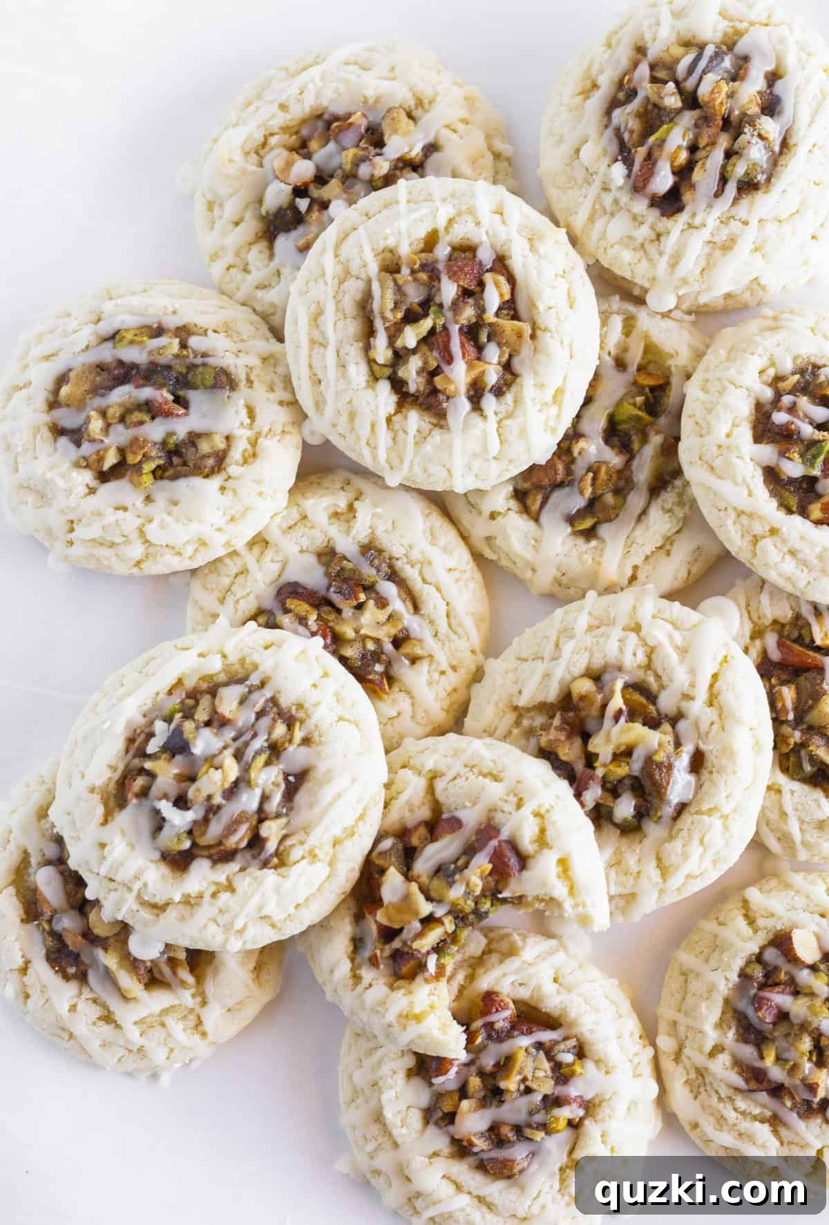 Holiday Cookie Exchange Favorites 10 Delicious Baklava cookies, generously drizzled with honey glaze, elegantly arranged on a white tray, showcasing their nutty layers.