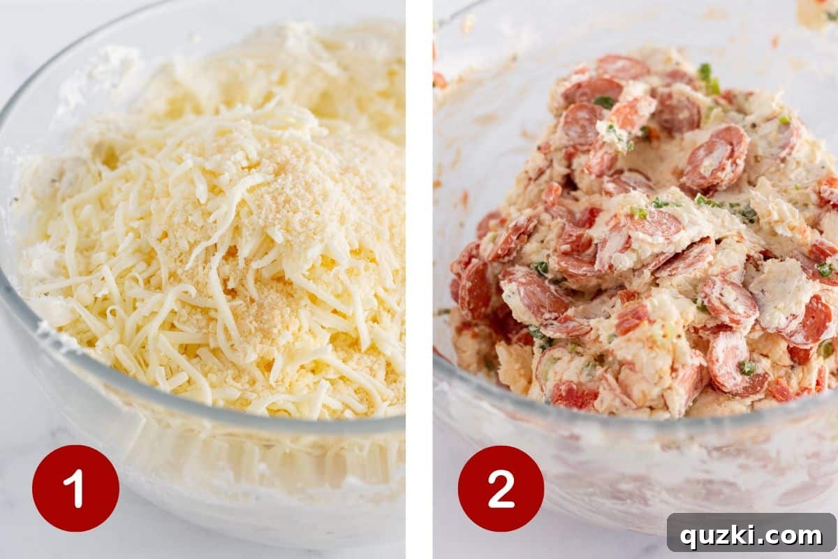Touchdown Pizza Cheese Ball 4 A large mixing bowl containing the rich and creamy cheese ball filling. Visible components include bright red mini pepperoni, small pieces of diced tomatoes, and green slivers of green onions, all being gently folded together with a rubber spatula.