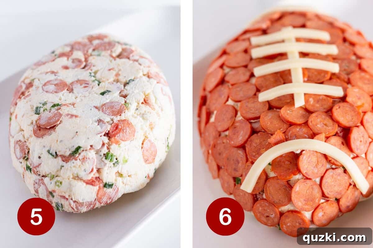 Touchdown Pizza Cheese Ball 6 The football-shaped cheese ball is being gently unwrapped from its plastic mold on a serving platter. In a subsequent step, the surface is meticulously covered with numerous mini pepperoni slices, creating the iconic texture of a football.