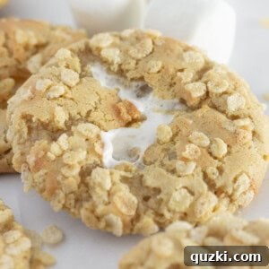 Rice Krispie cookies on a white tray with large marshmallows.