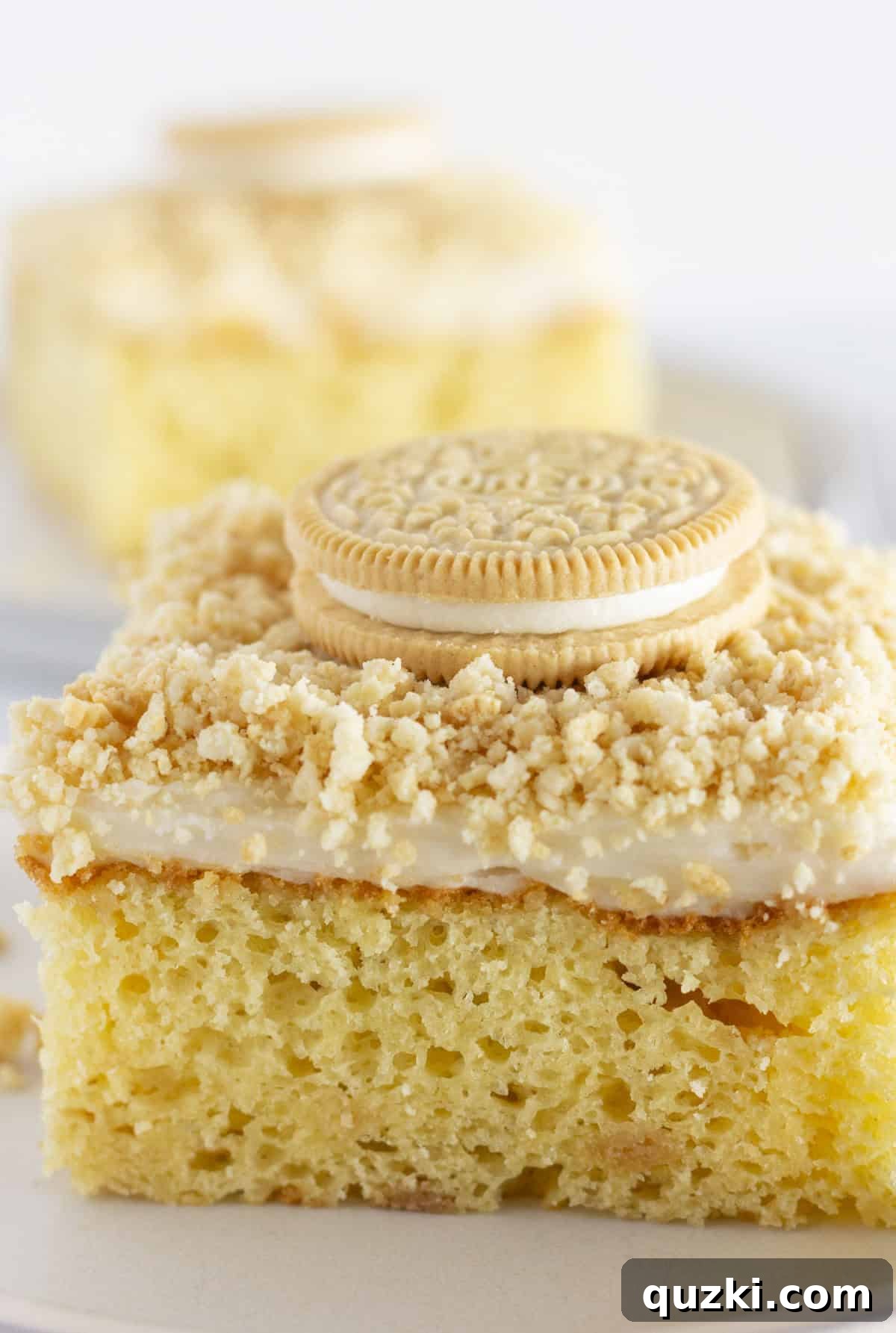 Golden Oreo Bliss Cake 7 A perfectly portioned piece of Golden Oreo cake resting on a serving plate, ready to be enjoyed.