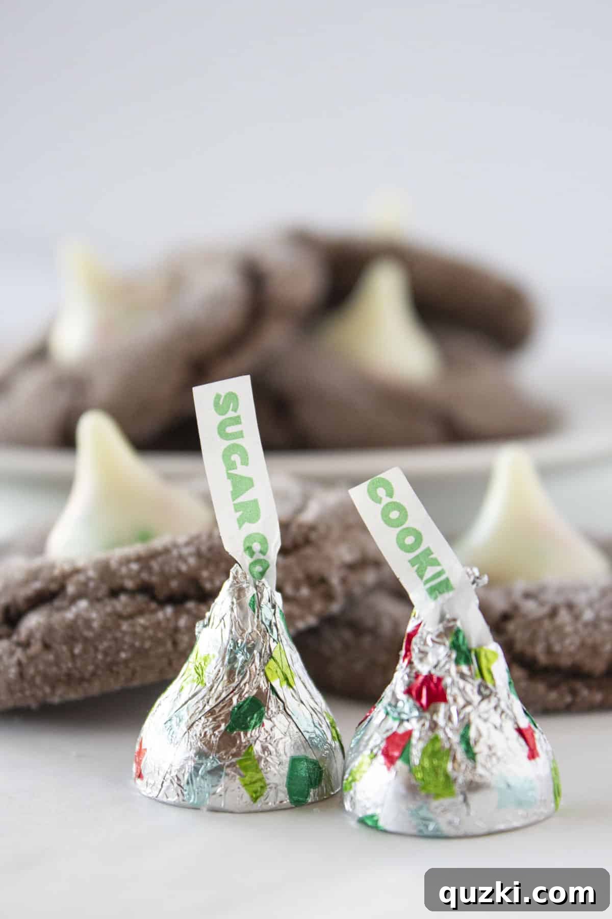 Cake Mix Cookie Magic: Decadent Chocolate Treats 28 Charming Chocolate Cake Mix Cookies topped with a festive Sugar Cookie Hershey's Kiss.