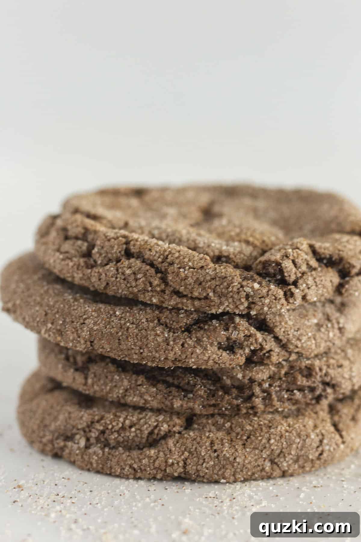 Cake Mix Cookie Magic: Decadent Chocolate Treats 4 A stack of four warm Mexican Hot Chocolate Cookies, dusted with cinnamon sugar and spices, evoking comforting flavors.