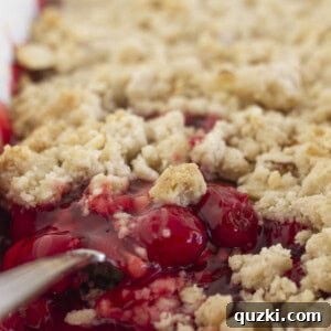 A close-up of cherry cobbler made with a cake mix, ready to be served.