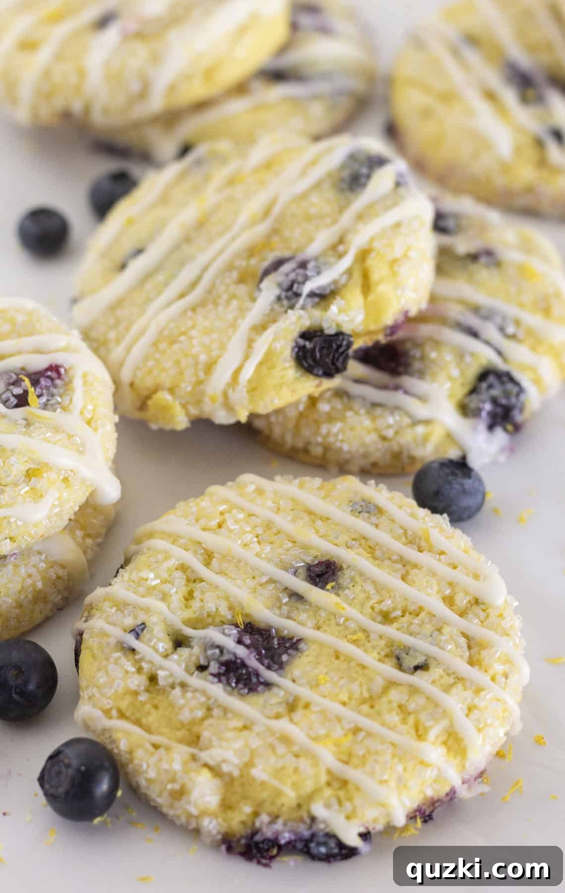 Lemon blueberry cake mix cookies with lemon glaze, beautifully arranged on a serving plate.