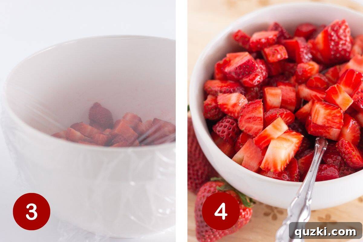 The bowl of sugared strawberries, covered with plastic wrap, ready for refrigeration and maceration.