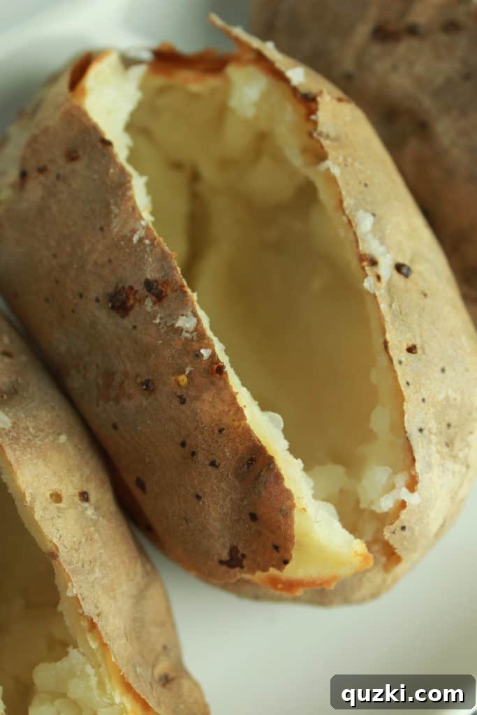 Step-by-step image of hollowing out a baked potato for stuffing