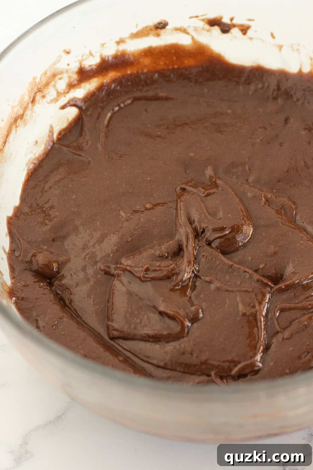 Fudgy Biscoff Cookie Butter Swirl Brownies 6 Mixing the brownie batter according to package directions.