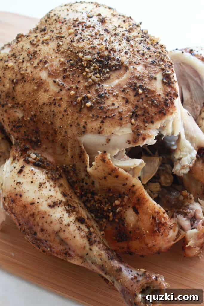 Cooked slow cooker chicken, legs easily pulling away.