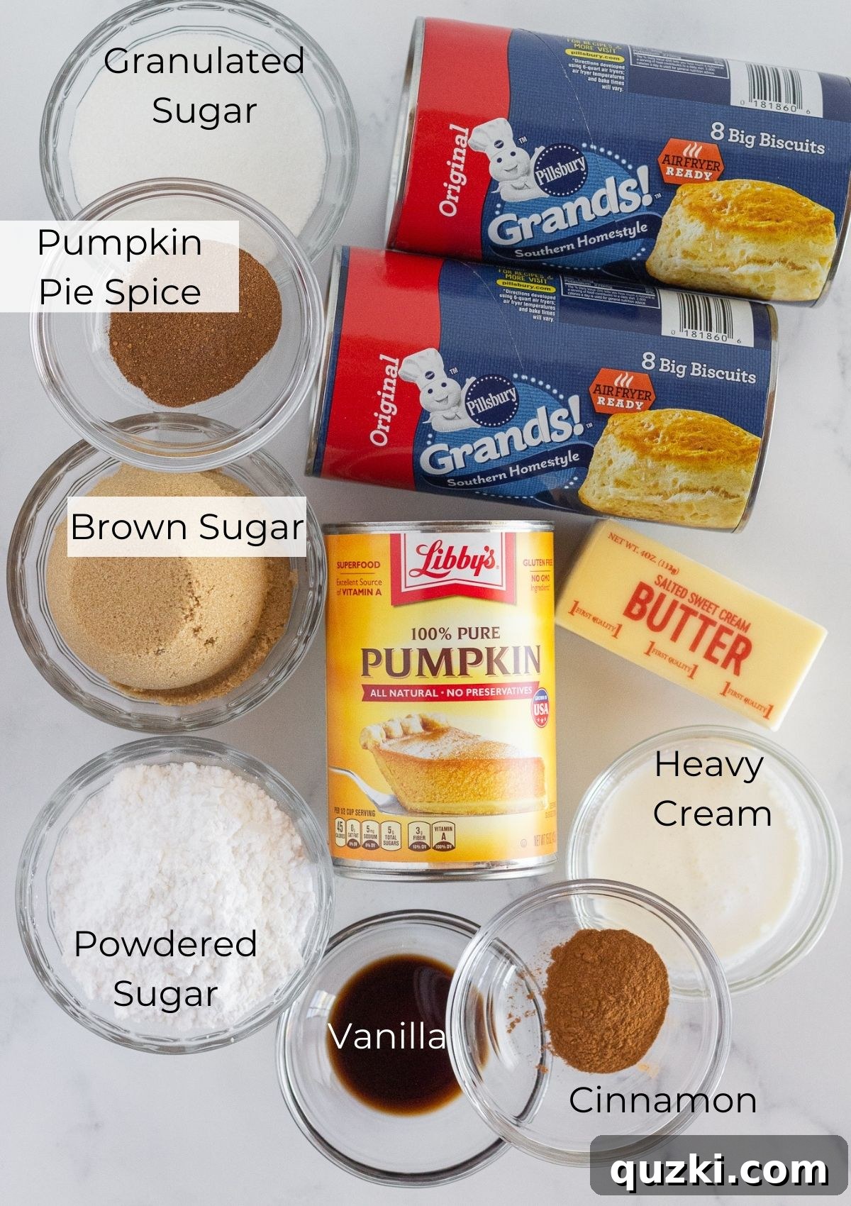 Heavenly Spiced Pumpkin Monkey Bread 3 All the necessary ingredients laid out to make delicious pumpkin monkey bread, featuring refrigerated biscuits, pumpkin puree, and spices.
