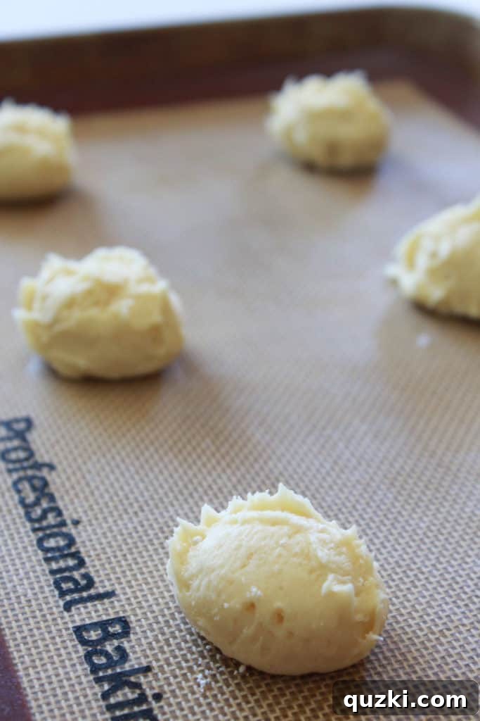 Freshly baked Kentucky Butter Cake Cookies cooling on a wire rack, showing their golden brown edges and soft centers. Keywords: homemade cookies, easy dessert, cake mix cookies.