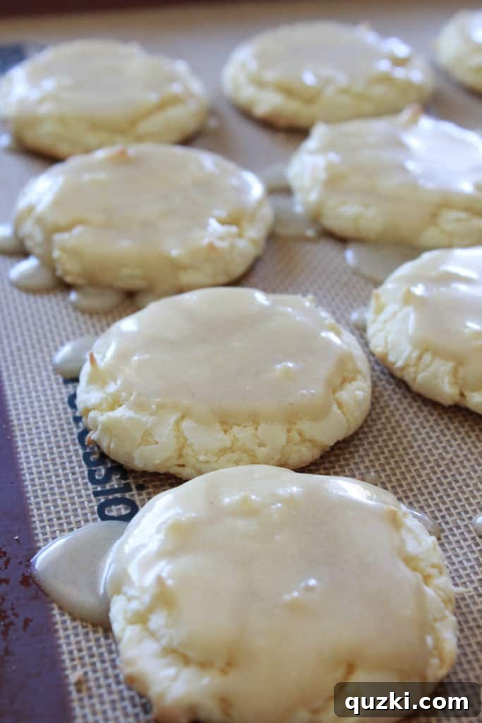A stack of finished Kentucky Butter Cake Cookies dusted with powdered sugar, showcasing their inviting texture. Keywords: ultimate cookies, delicious dessert, cake mix magic.
