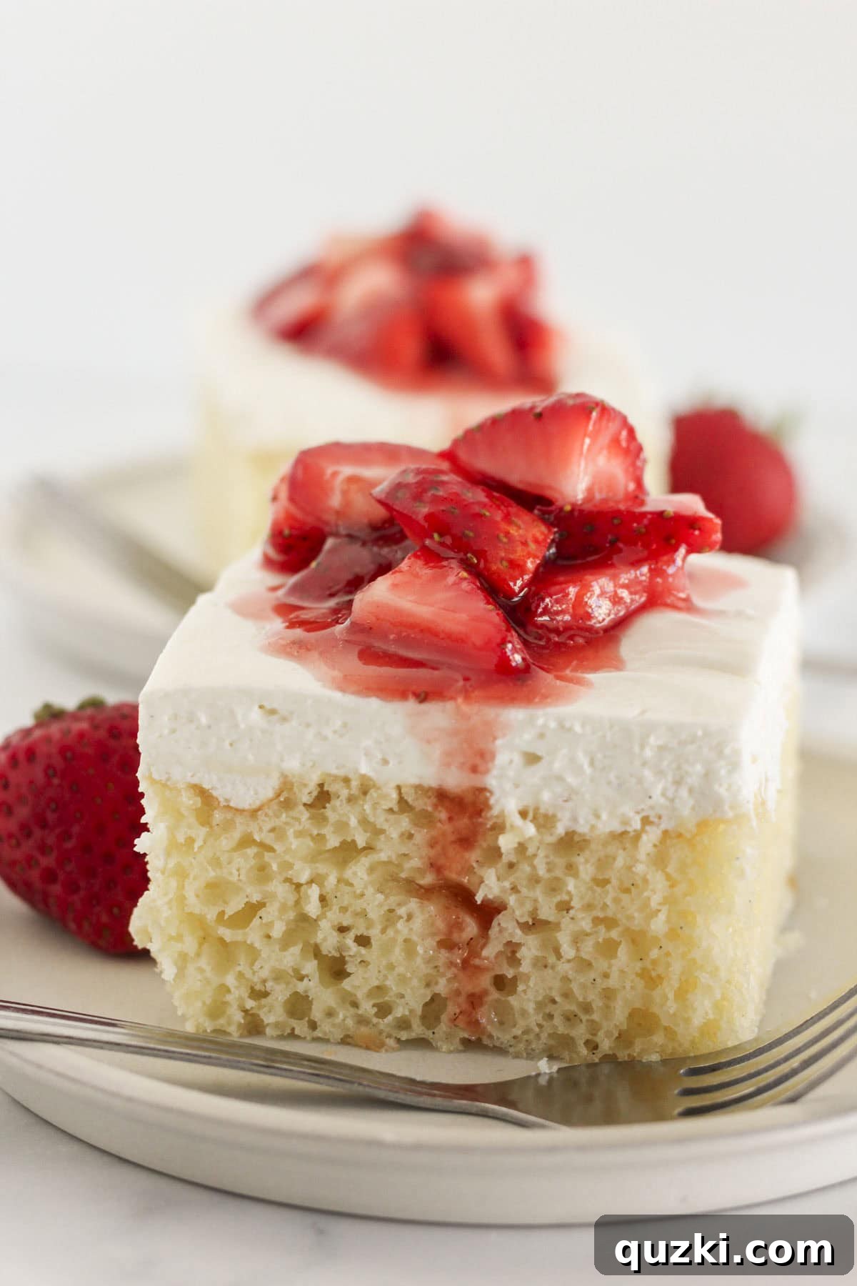 Vanilla Cake Mix: A Perfect White Cake Substitute? 2 Vanilla Cake Mix Sheet Cake topped with frosting and strawberries, showcasing a delicious dessert.