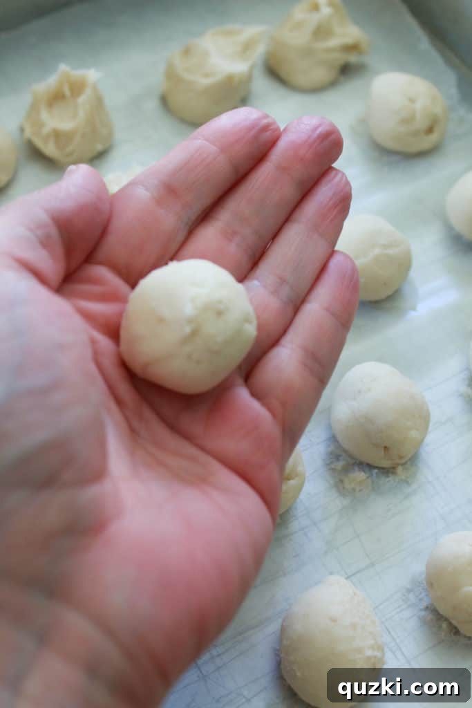 Pumpkin Swirl Cookies 4 Frozen cream cheese frosting balls, rolled into uniform spheres, ready for stuffing into cookies.