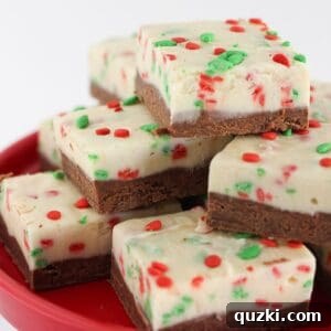 Double layer fudge on a tray and ready to serve, showing perfect squares with festive sprinkles.