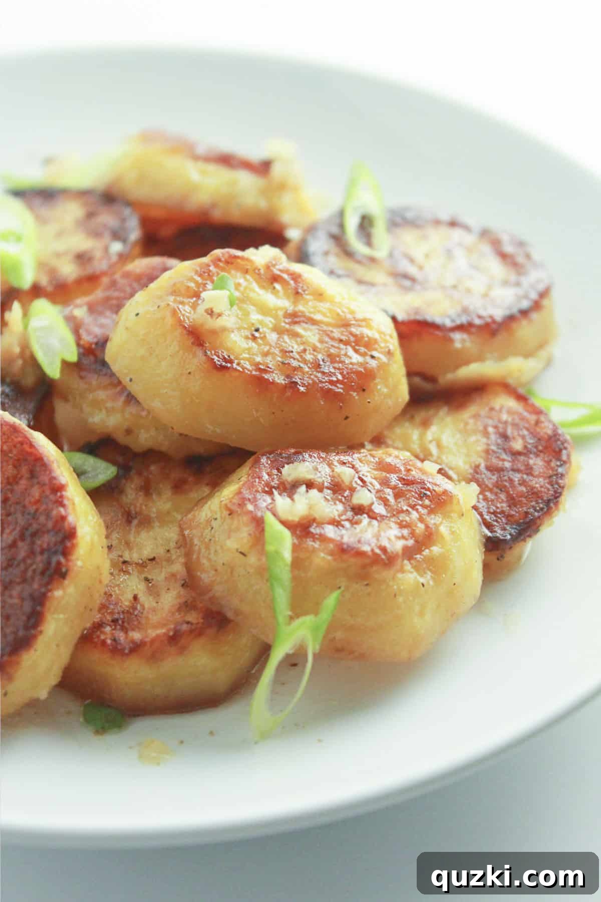 A plate of perfectly roasted melting potatoes, a wonderful last minute Christmas recipe.