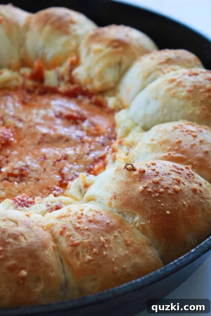 A savory and fun Pepperoni Pizza Biscuit Pull-Apart Dip, featuring golden-brown biscuits baked around a gooey, cheesy pepperoni pizza filling, ready to be pulled and dipped.