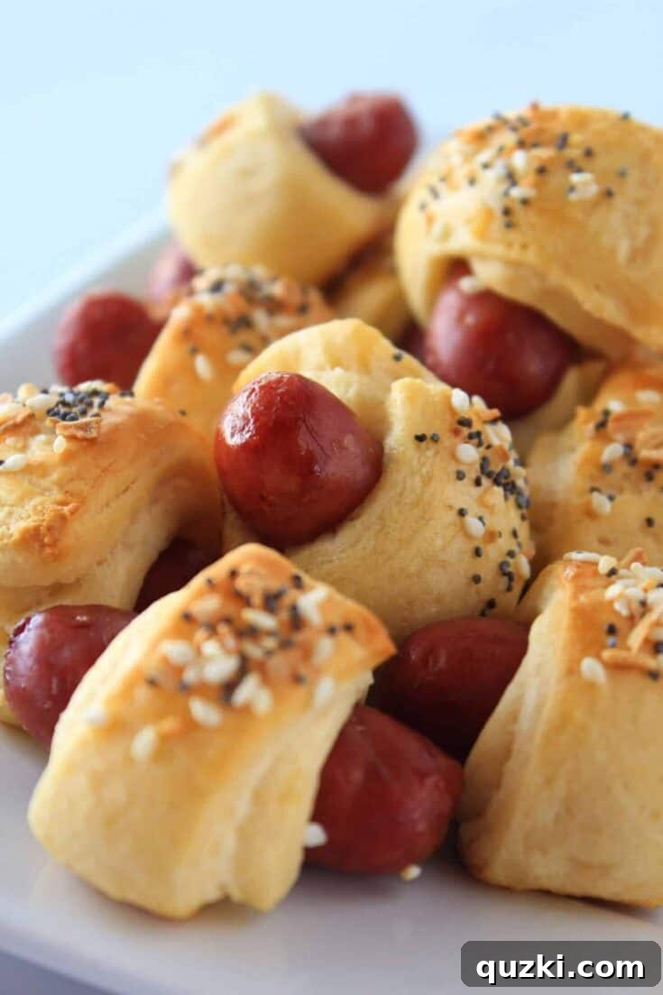 Classic Pigs in a Blanket elevated with a generous sprinkling of everything bagel seasoning, showcasing the crunchy and flavorful exterior.