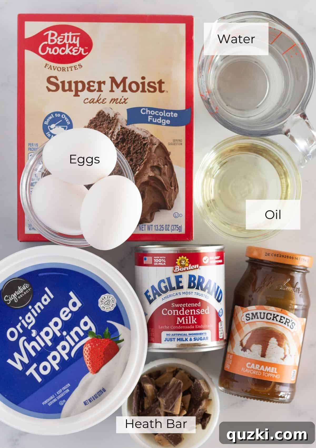 Pure Chocolate Bliss Cake 3 The essential ingredients laid out for making a Better Than Anything Bundt Cake, including cake mix, condensed milk, caramel, and Heath bars.