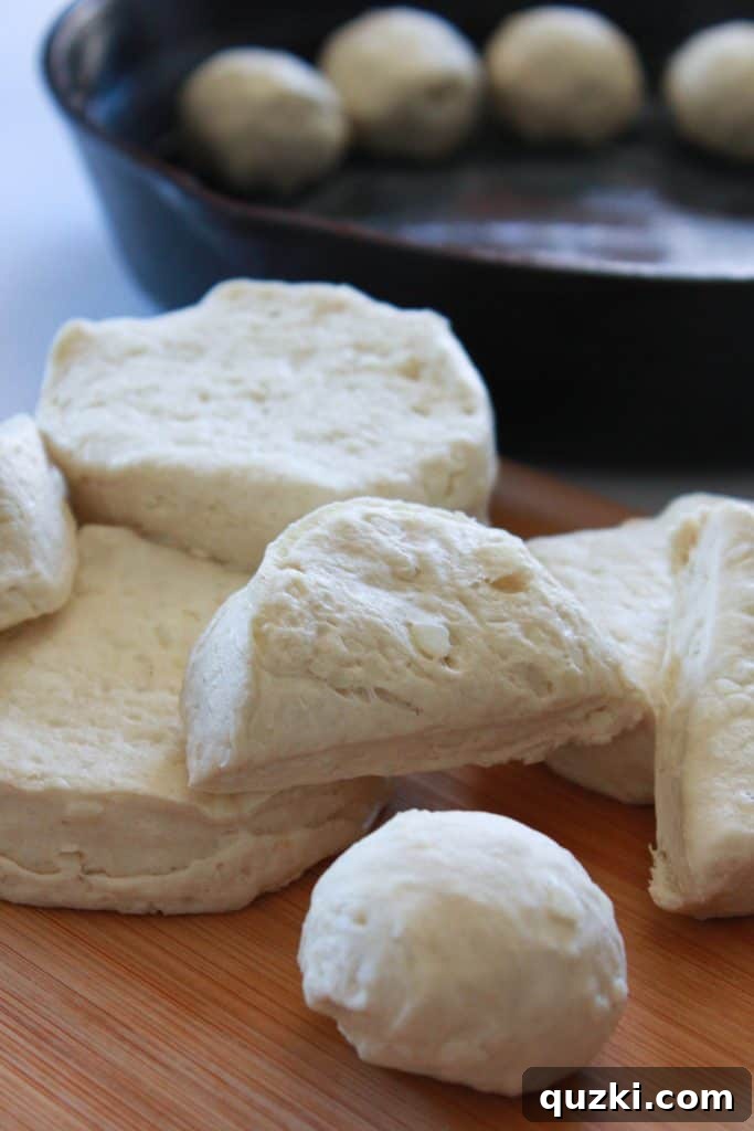 Refrigerated biscuit halves rolled into balls and arranged around the edge of a buttered cast iron skillet