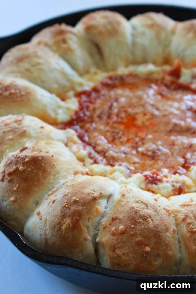 Freshly baked Pepperoni Pizza Biscuit Pull-Apart Dip, hot and bubbly with golden biscuits, straight from the oven