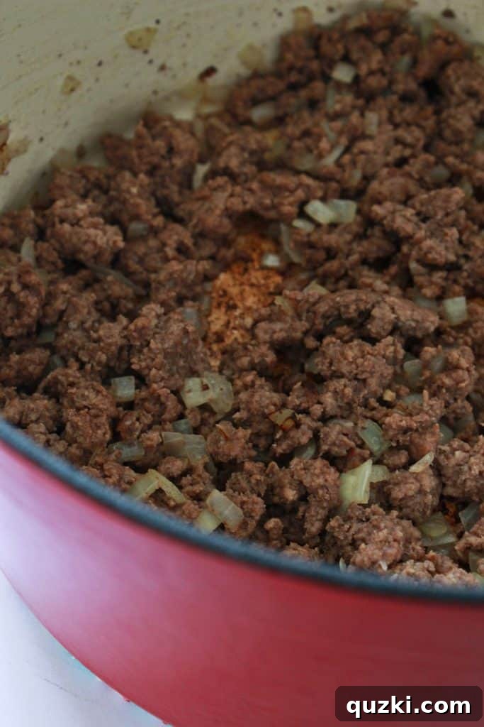 Browning ground beef and sautéing diced onions in a pot for 30 minute chili.