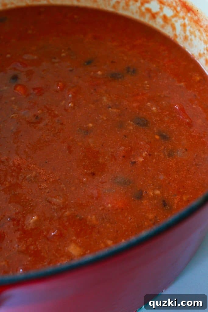 Chili simmering with black beans, tomato sauce, and Rotel for a quick and easy meal.