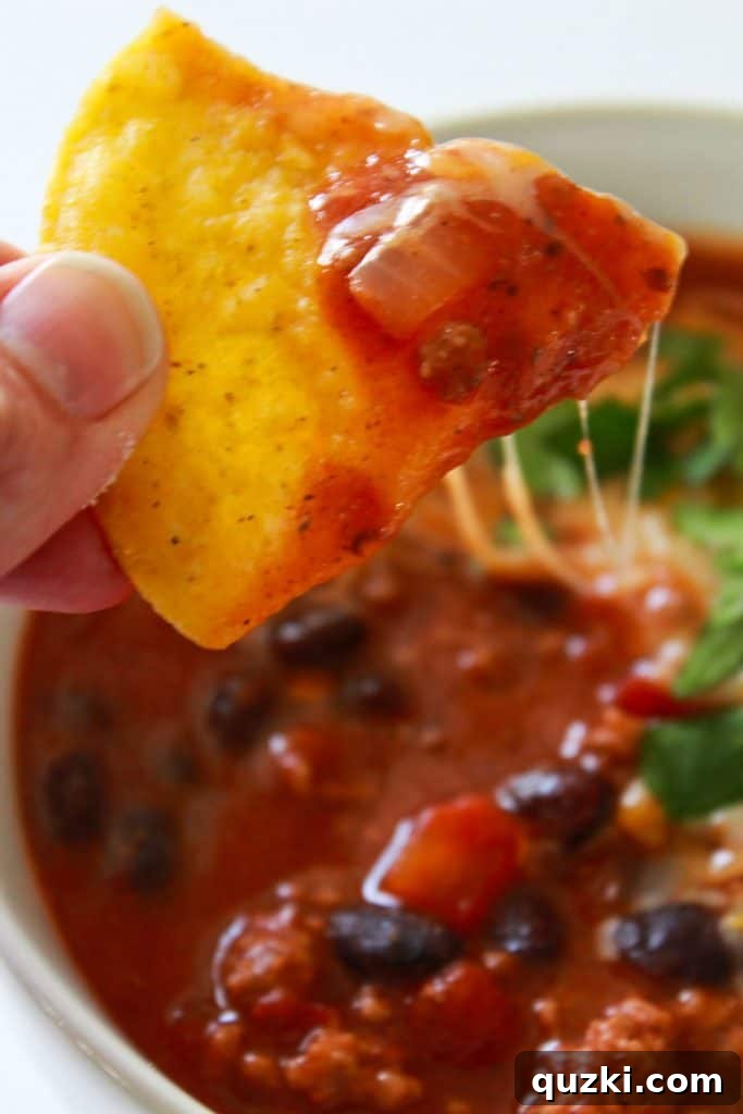 Finished 30 Minute Chili garnished with fresh toppings, ready to serve.