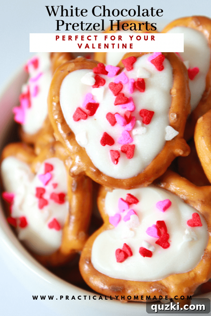White Chocolate Dipped Pretzel Hearts 2 Delicious White Chocolate Pretzel Hearts adorned with festive sprinkles, perfect for Valentine's Day gifting or sharing. A vibrant, homemade treat.