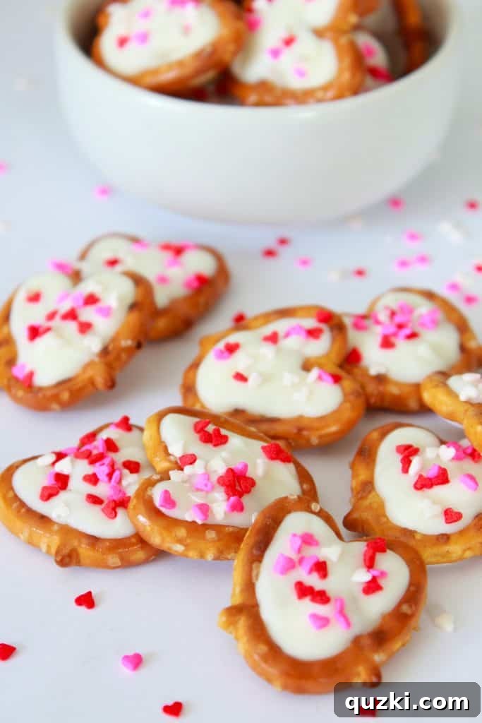 White Chocolate Dipped Pretzel Hearts 8 A vibrant collection of finished White Chocolate Pretzel Hearts, beautifully arranged and ready to be served or gifted.