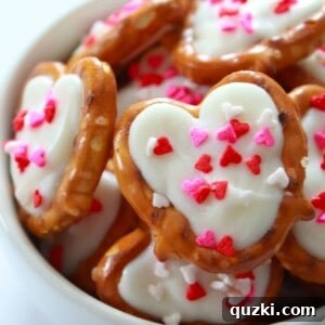 White Chocolate Pretzel Hearts - a delicious and easy Valentine's Day dessert recipe, adorned with sprinkles.