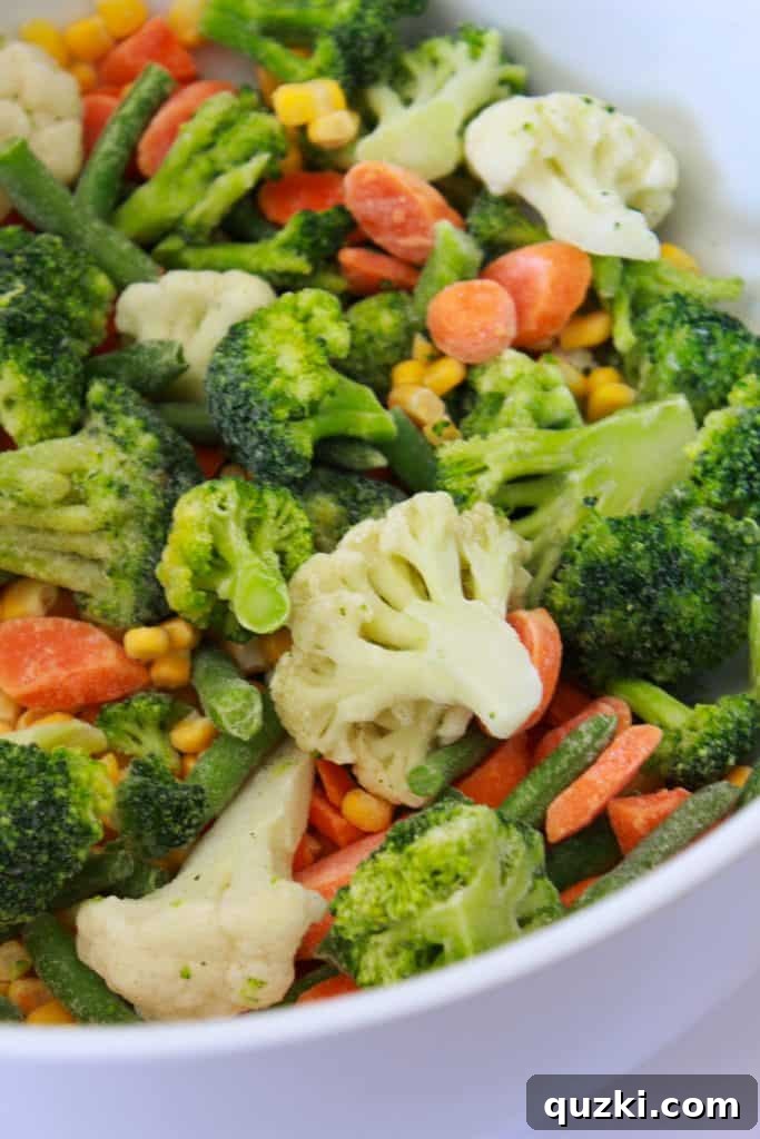 Effortless Frozen Vegetable Bake 3 Frozen Vegetable Casserole Recipe featured by top US food blog, Practically Homemade - mixing vegetables