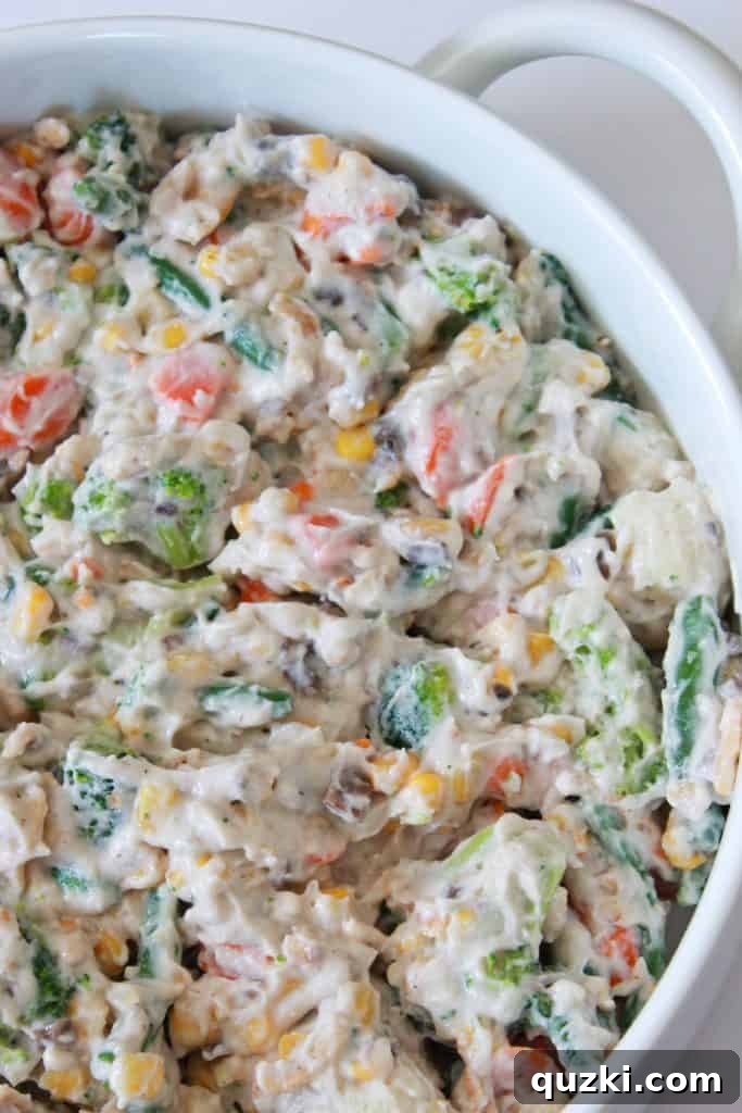 Effortless Frozen Vegetable Bake 4 Frozen Vegetable Casserole Recipe featured by top US food blog, Practically Homemade - casserole mixture in baking dish