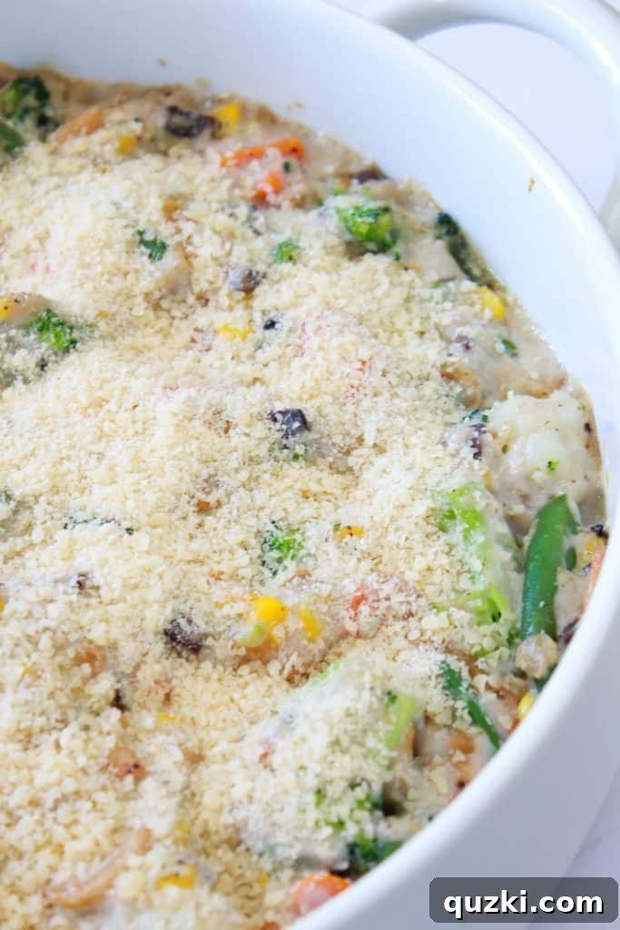 Effortless Frozen Vegetable Bake 5 Frozen Vegetable Casserole Recipe featured by top US food blog, Practically Homemade - casserole topped with Parmesan cheese