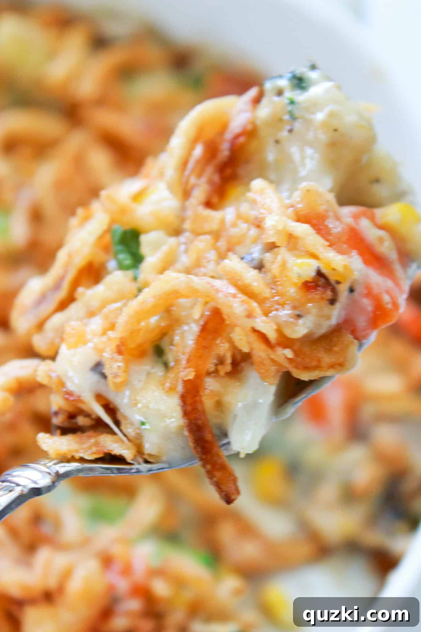 Effortless Frozen Vegetable Bake 8 Frozen Vegetable Casserole Recipe featured by top US food blogger, Practically Homemade - close up of casserole serving