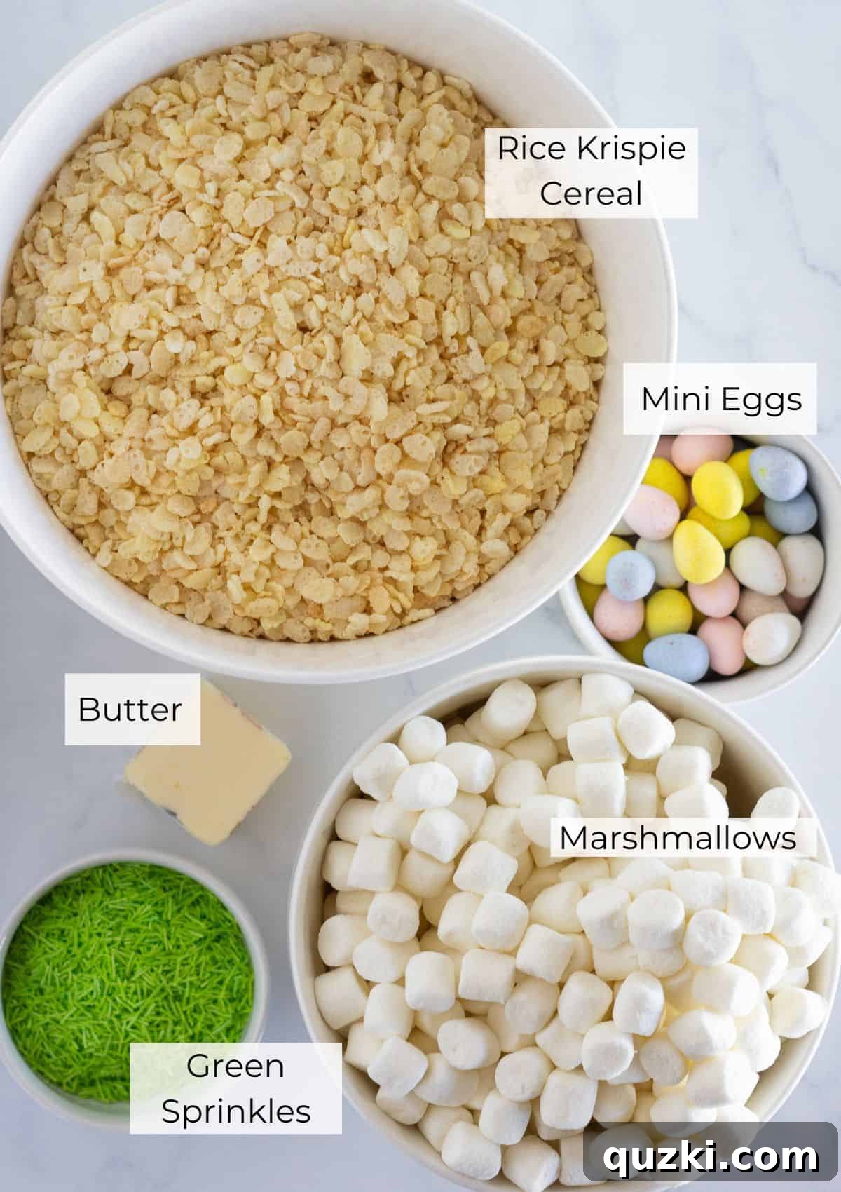 The simple ingredients laid out for making delicious Rice Krispie Nests, including cereal, marshmallows, butter, and mini eggs.
